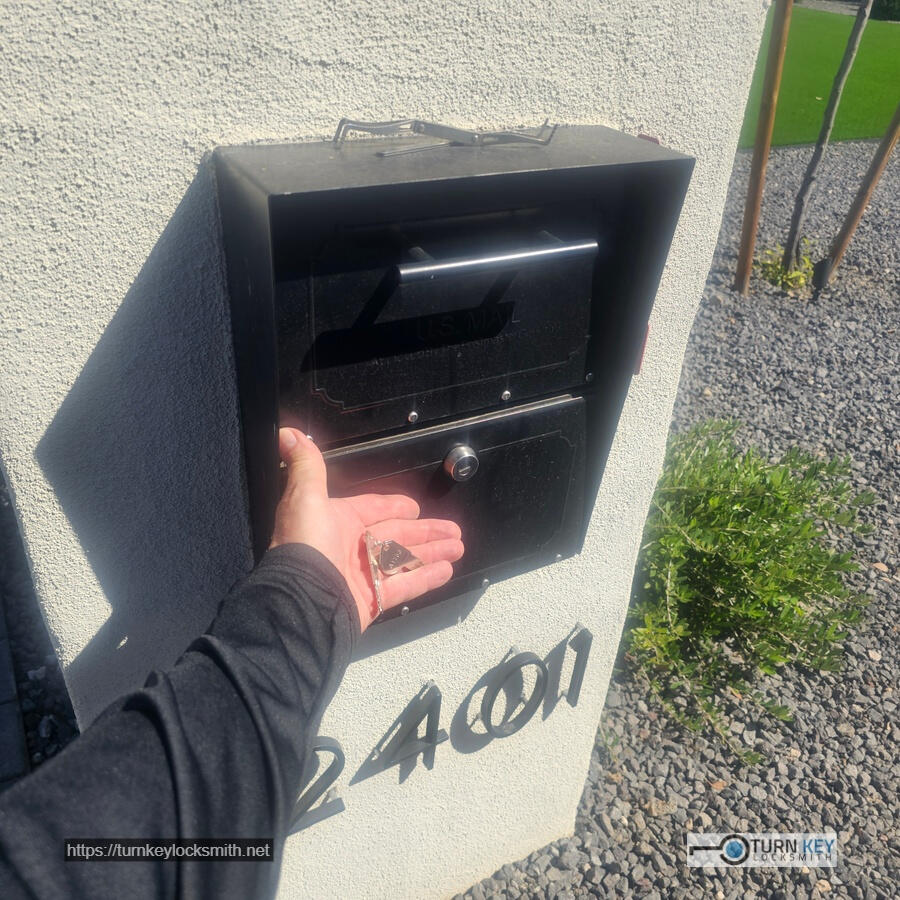 Mobile locksmith opening a locked residential USPS mailbox and providing mailbox lockout service in the Paradise Valley Village neighborhood of Scottsdale, Arizona