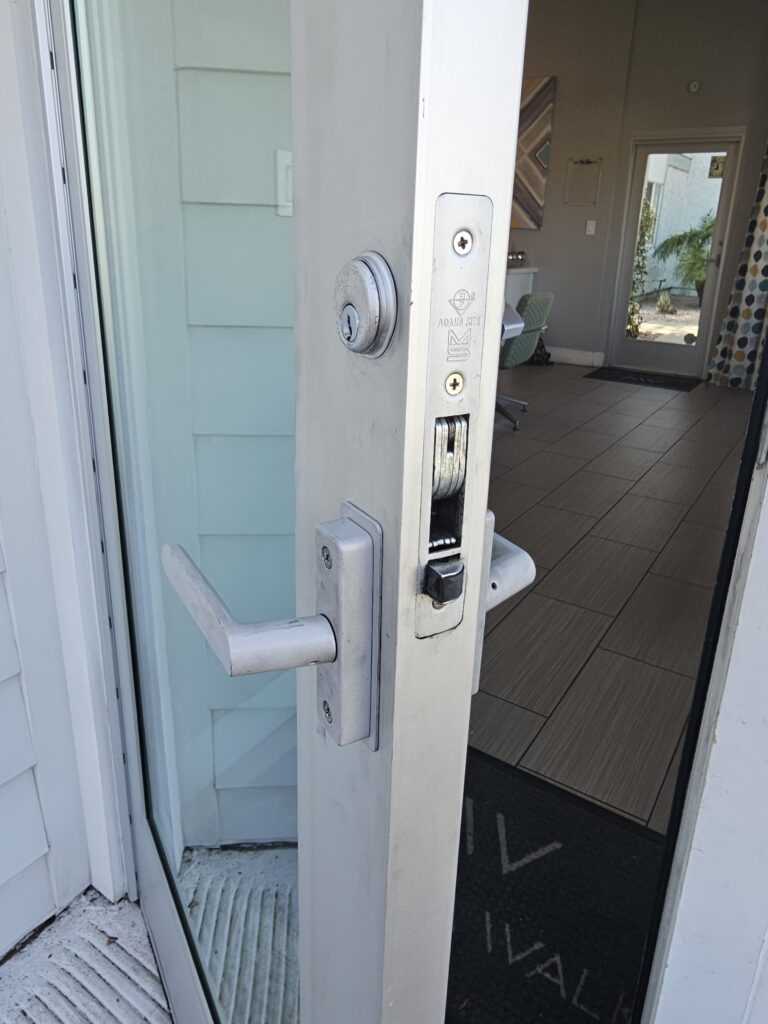 Open door with a silver handle and lock, inviting entrance to Home. Turn Key Locksmith, Phoenix AZ